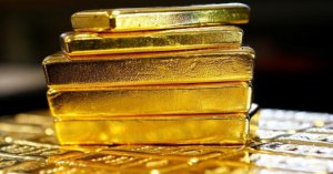 الذهب ينخفض مع صعود الدولار و ترقب اجتماع المركزي الأمريكي
