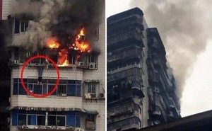 بالفيديو .. صيني يتدلى من الطابق 24 لينجو من حريق ضخم في منزله